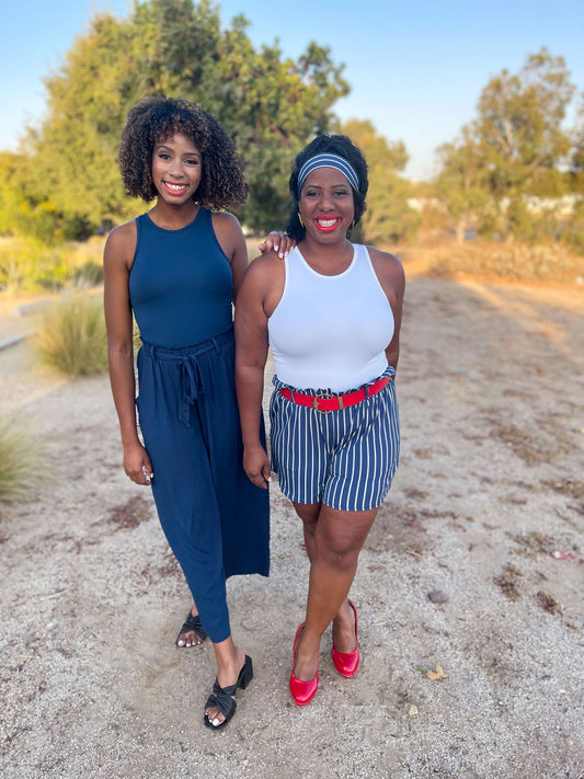 Lularoe Hope bodysuit with a scoop neckline, short sleeves, and a form-fitting silhouette made from soft, stretchy fabric.